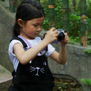 Girl taking photos, China portraits