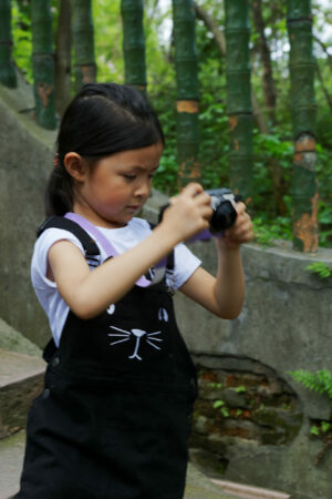 Girl taking photos, China portraits